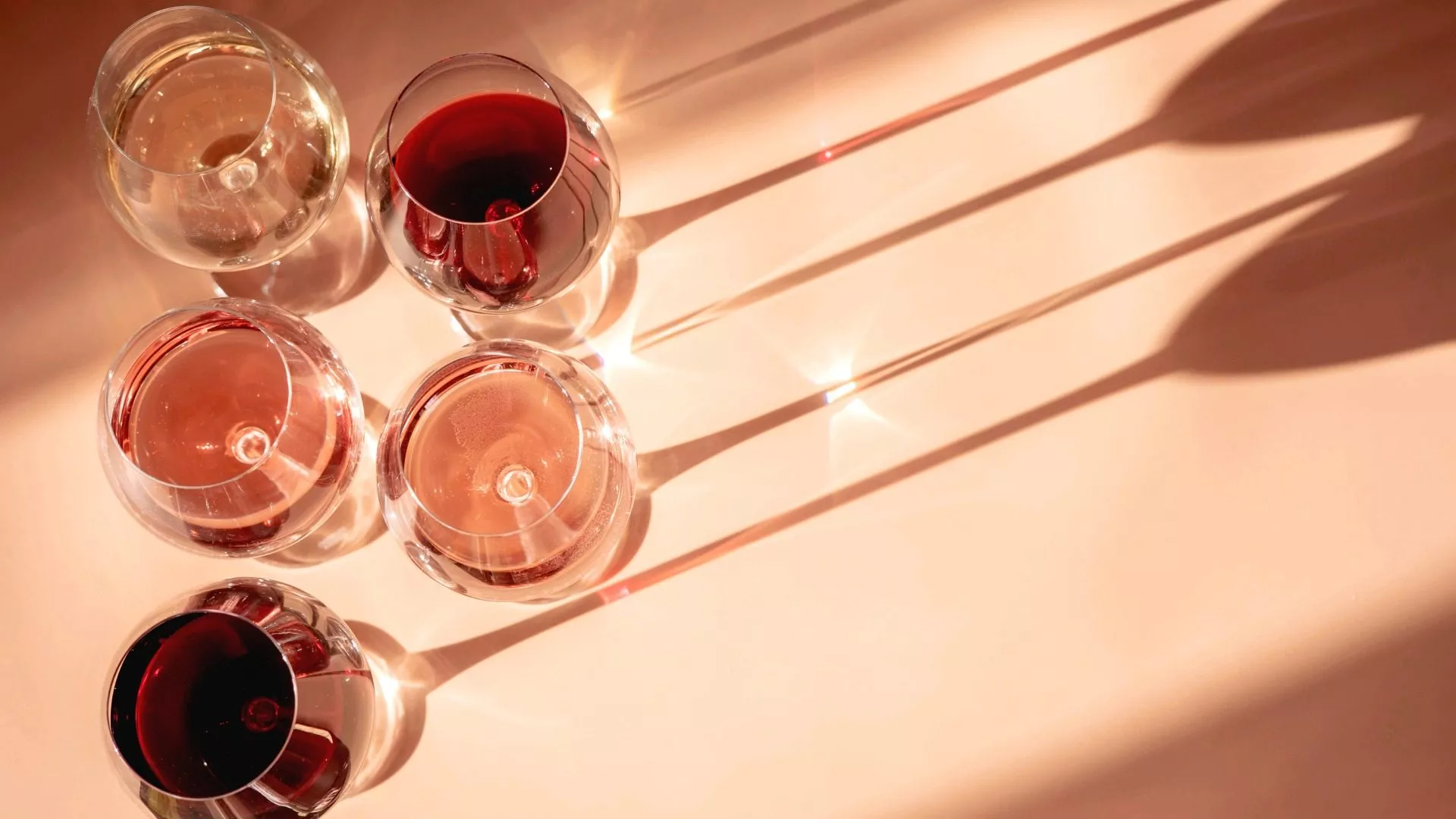 glasses-of-red-rose-and-white-wine-with-sunshine-2024-10-18-05-51-58-utc-1.jpg